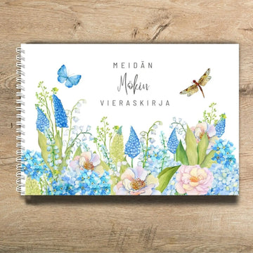 Mökki vieraskirja omalla tekstillä kukkapellon kuvalla Decopaja