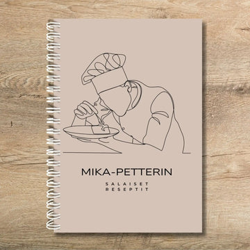 Täytettävä reseptikirja omalla tekstillä kokin kuvalla Decopaja